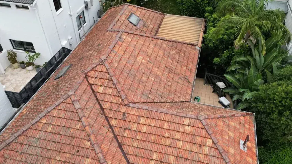 Roof replacement in Mosman, before: weathered terracotta tiles